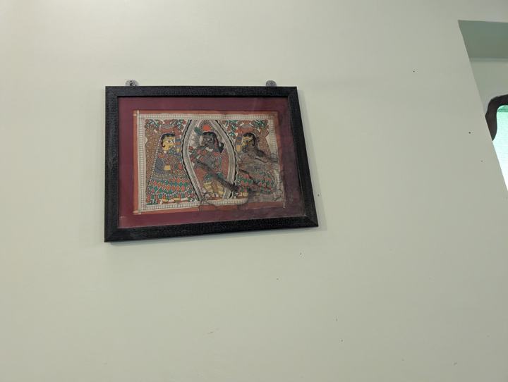Framed Mithila-style artwork